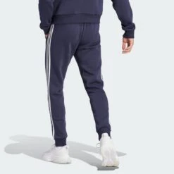 ADIDAS Essentials Fleece 3-Stripes Tapered Cuff Broek -Adidas Verkoopwinkel essentials fleece 3 stripes tapered cuff broek 2